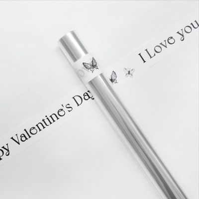 ভালো দাম রোমান্টিক ফুলের প্যাকেজিং কাগজ স্বচ্ছ ওপিপি সেলফান রোল ডিওয়াই প্যাকেজিংয়ের জন্য 57 * 1000cm অনলাইন